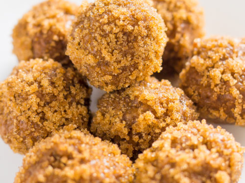 Keto peanut butter balls stacked on one another