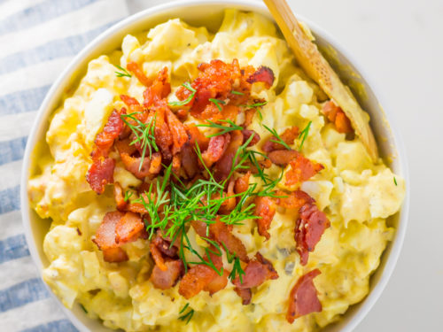 Keto egg salad topped with bacon