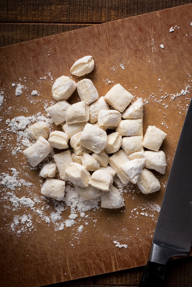 floured canned biscuit pieces ready to cook as dumplings