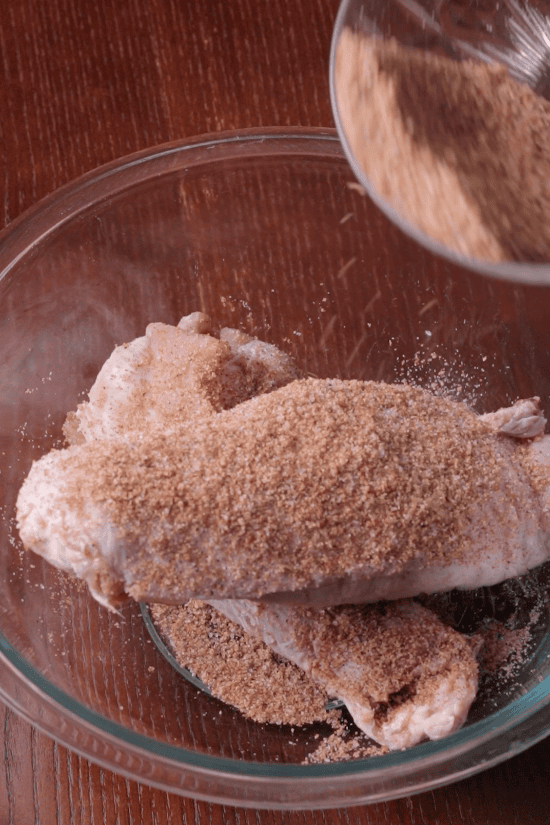 Step 1: Raw turkey wings coated with seasoning before cooking in the crockpot