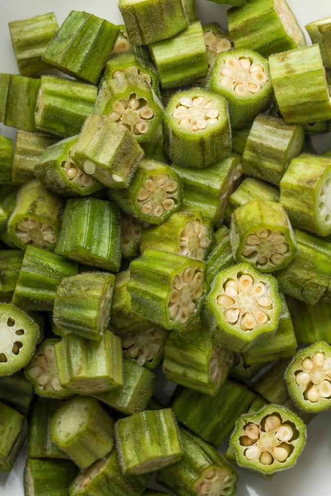 Fresh okra sliced into 1/2- to 3/4-inch pieces before breading for fried okra.