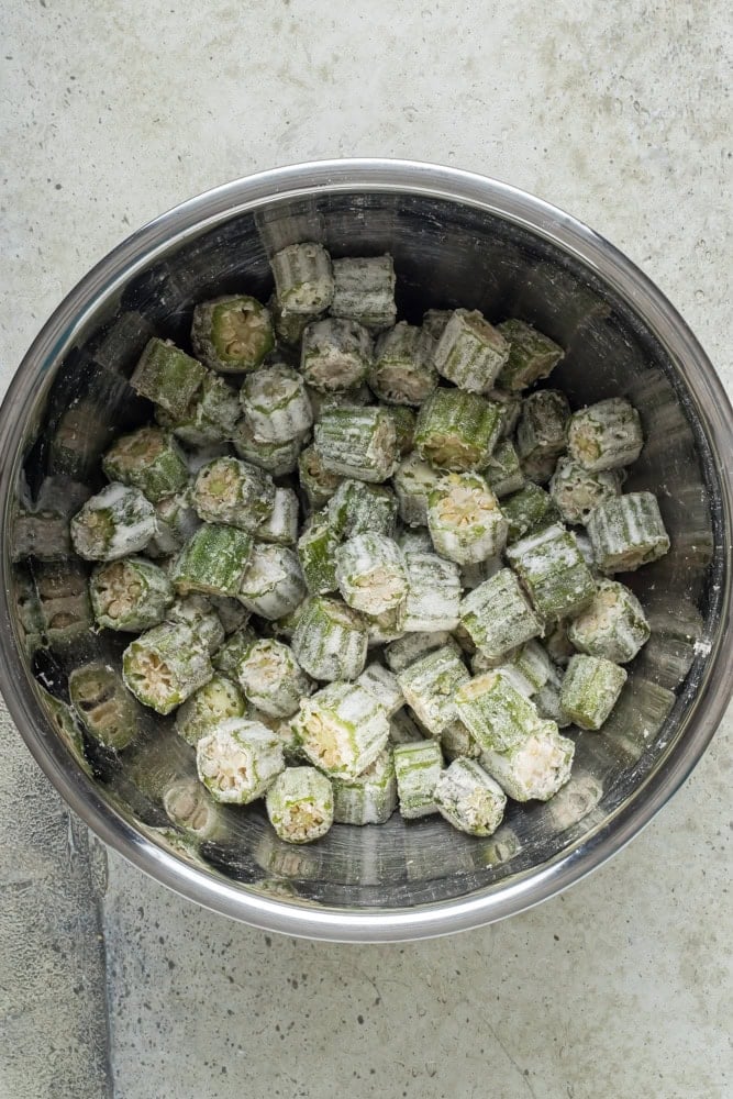 Sliced fresh okra tossed with all-purpose flour before adding the buttermilk egg wash.