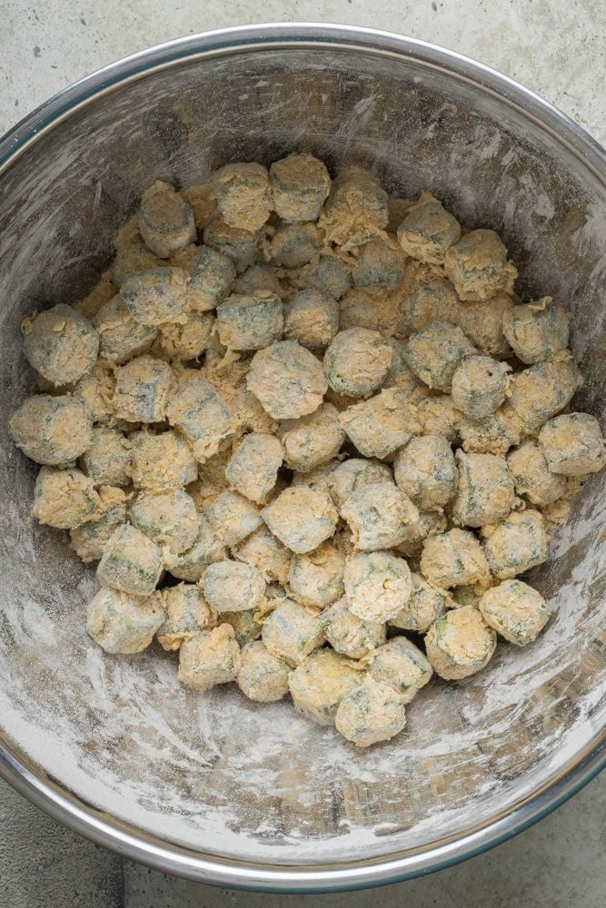 Okra tossed in seasoned cornmeal and flour breading before frying.