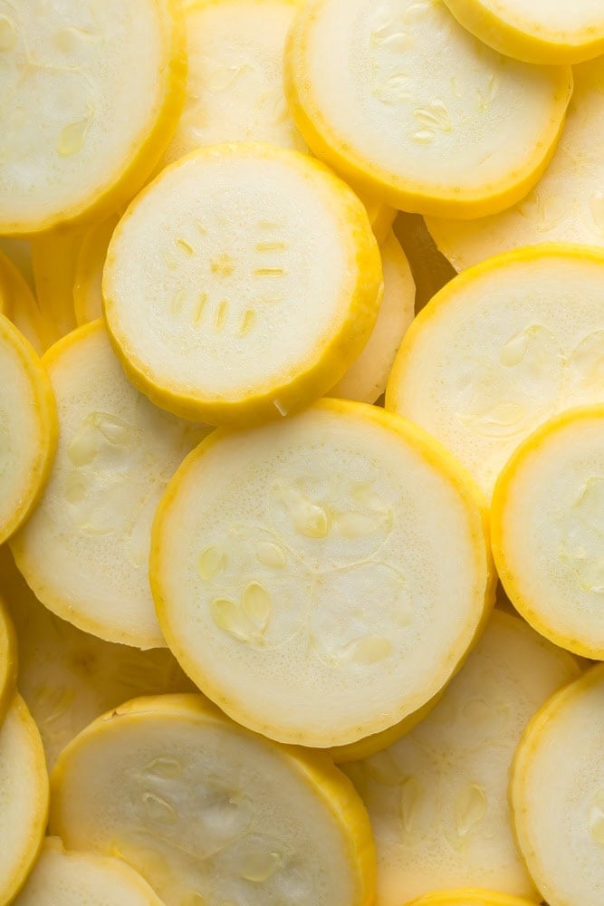 Thin slices of fresh yellow squash with the skin left on for Southern fried squash.